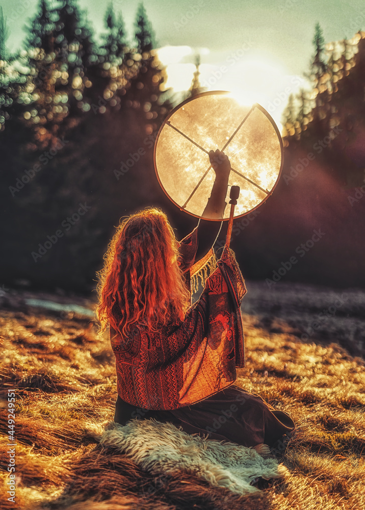 beautiful shamanic girl playing on shaman frame drum in the nature. Stock  Photo | Adobe Stock