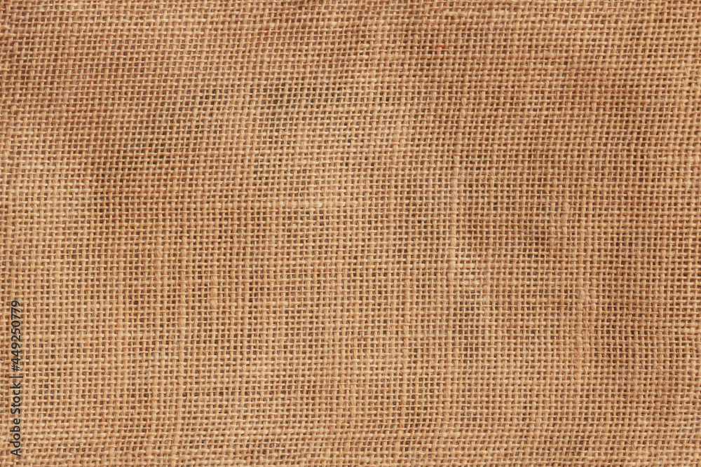 Brown burlap texture, piece of rough fabric woven of flax, jute or hemp. Brown burlap texture, piece of rough fabric woven of flax, jute or hemp.