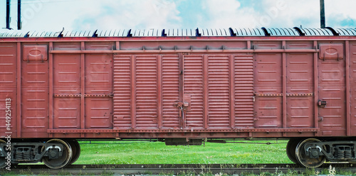 Large container on a railway platform in daylight. Freight train on railway tracks. photo