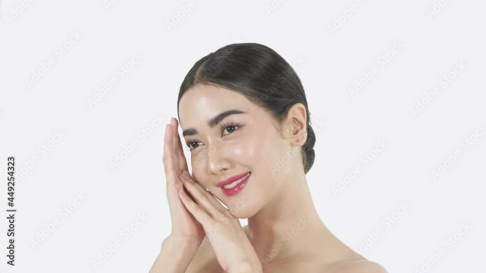 Beauty concept of 4k Resolution. Asian girl is touching her face on a white background. Beauty concept of 4k Resolution. Asian girl is touching her face on a white background.
