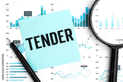 Word TENDER on sticker, magnifier, chart, diagram. Close up.