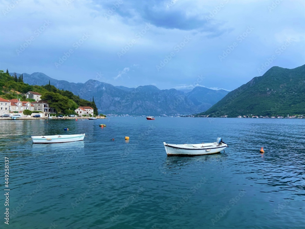 Travel Journey - Perast, Montenegro. Boats on the coast

