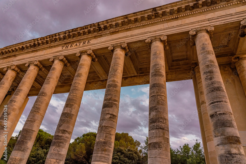 Exterior view of ancient roman theater building. Ancient open-air theater near Nimes, France. Rome architecture and landmark. High quality photo Exterior view of ancient roman theater building. Ancient open-air theater near Nimes, France. Rome architecture and landmark. High quality photo