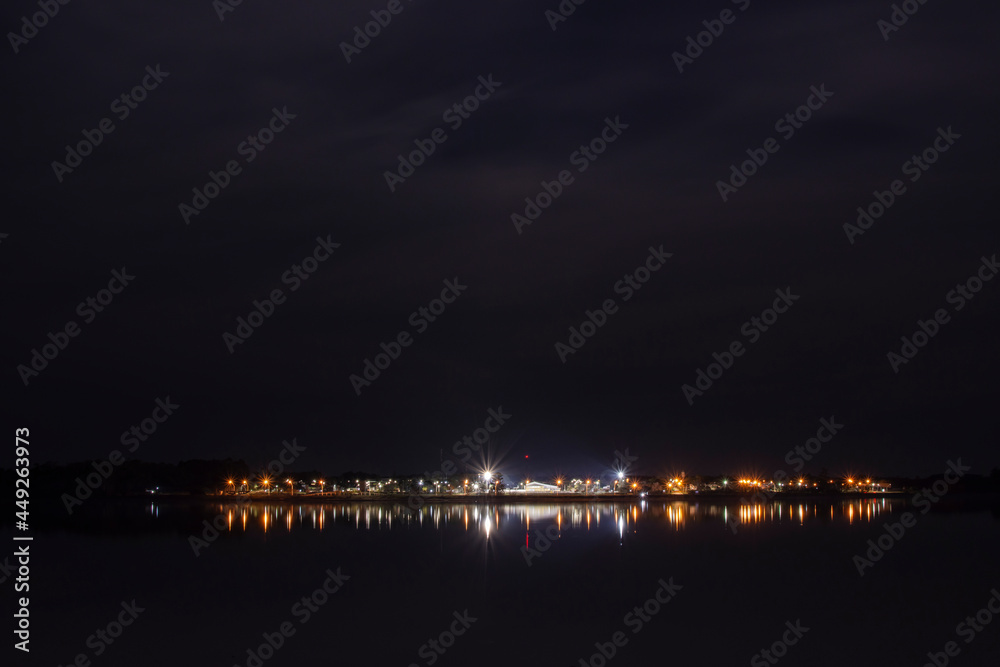 Night shot of the Uruguay River´s coast and the little town of Santa Ana, Entre ríos, Argentina on a cloudy night.