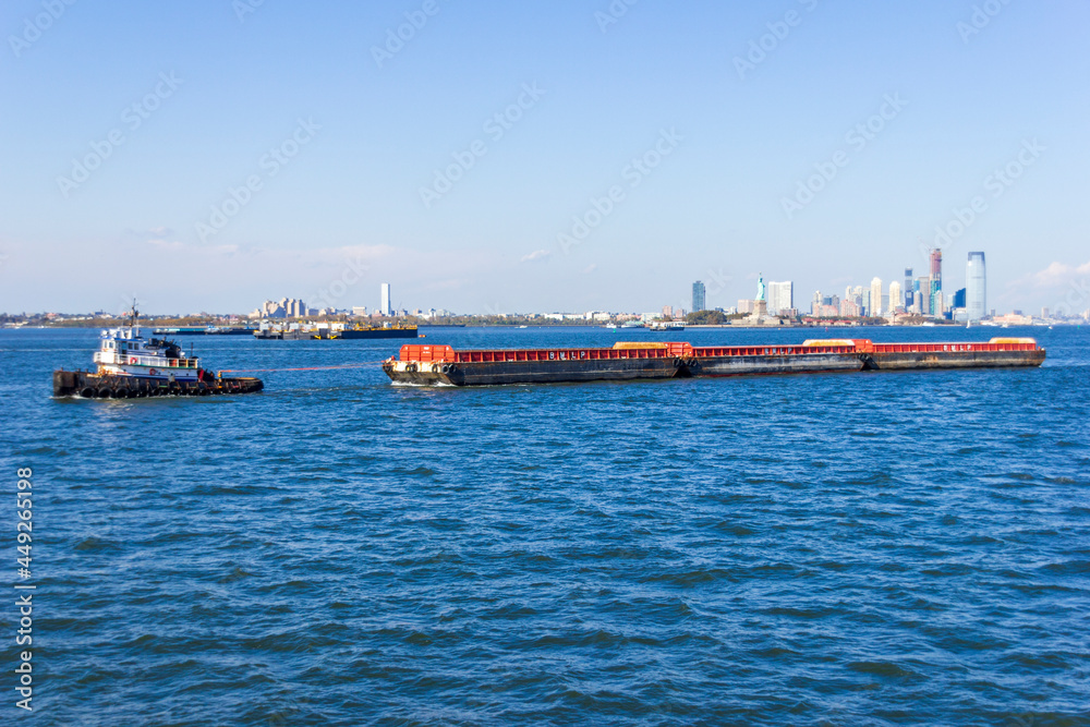 A boat shipping cargo between New York and New Jersey, USA A boat shipping cargo between New York and New Jersey, USA