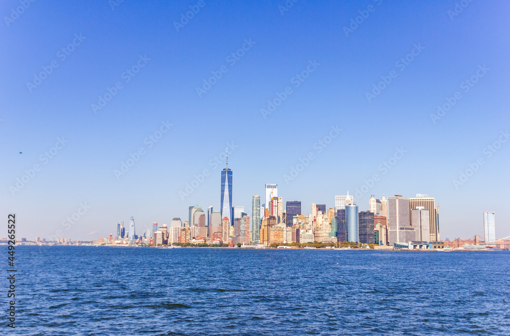A picture of Manhattan skyline with Battery Park and Maritime terminals, bridges and Brooklyn, NY, USA