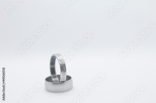 two silver rings on white background © Javier