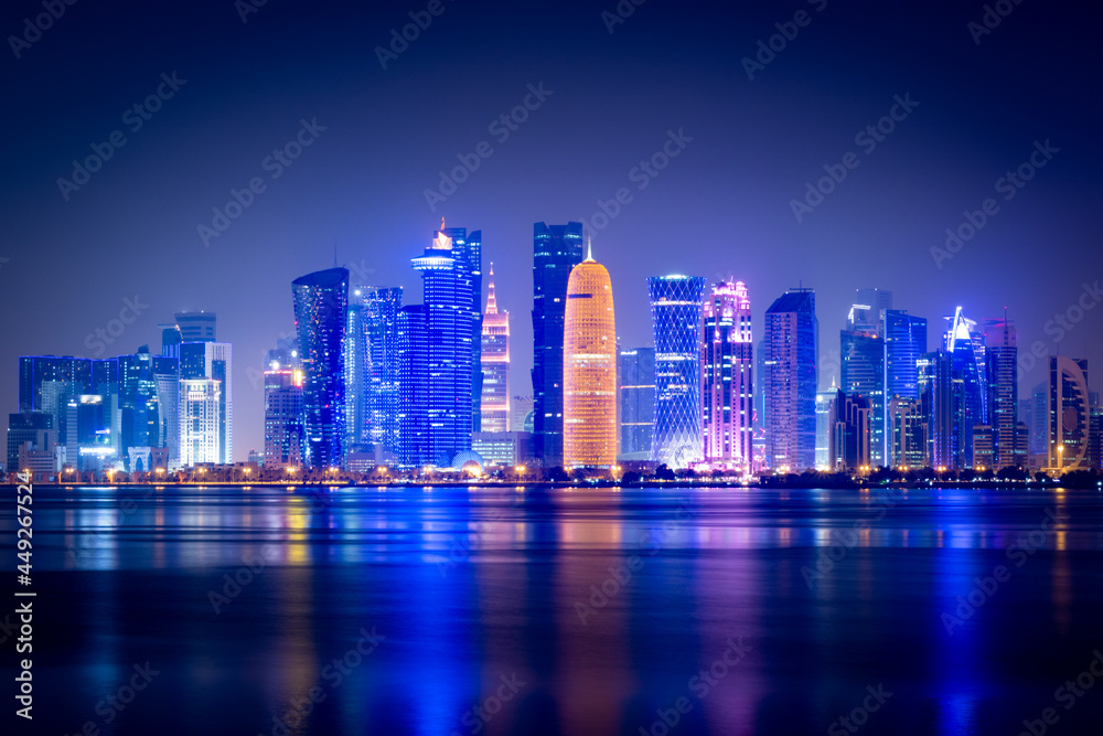 Illuminated skyline of Doha at night, Qatar, Middle East.