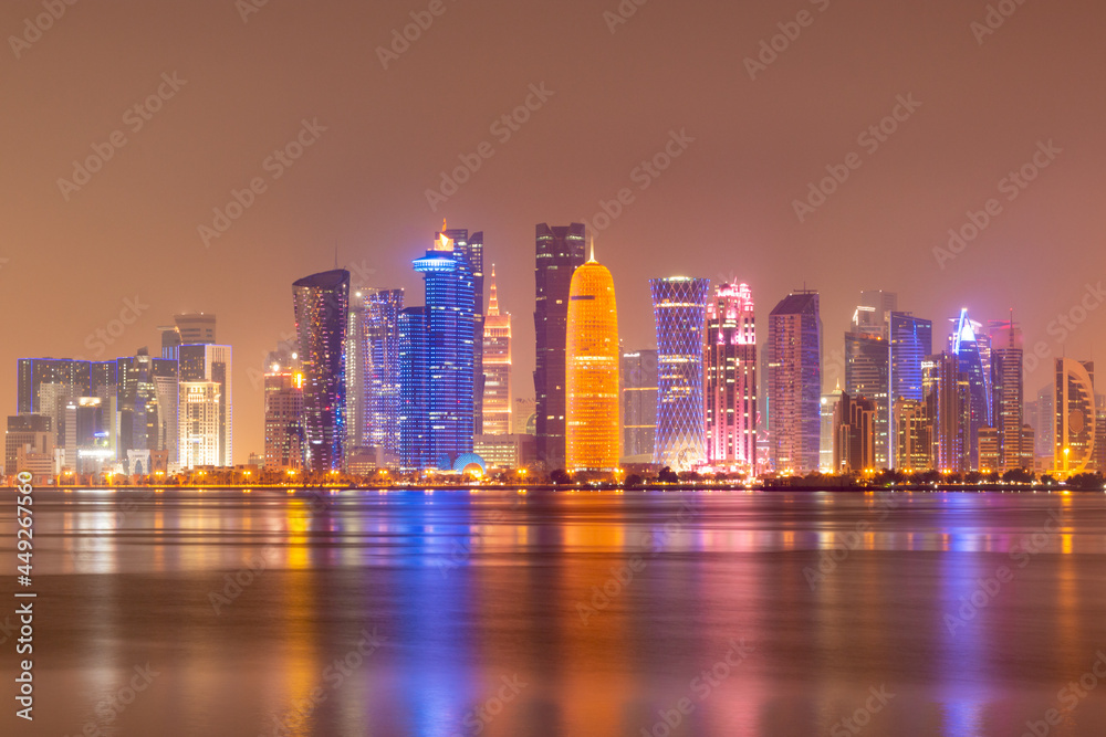 Fototapeta premium Illuminated skyline of Doha at night, Qatar, Middle East.