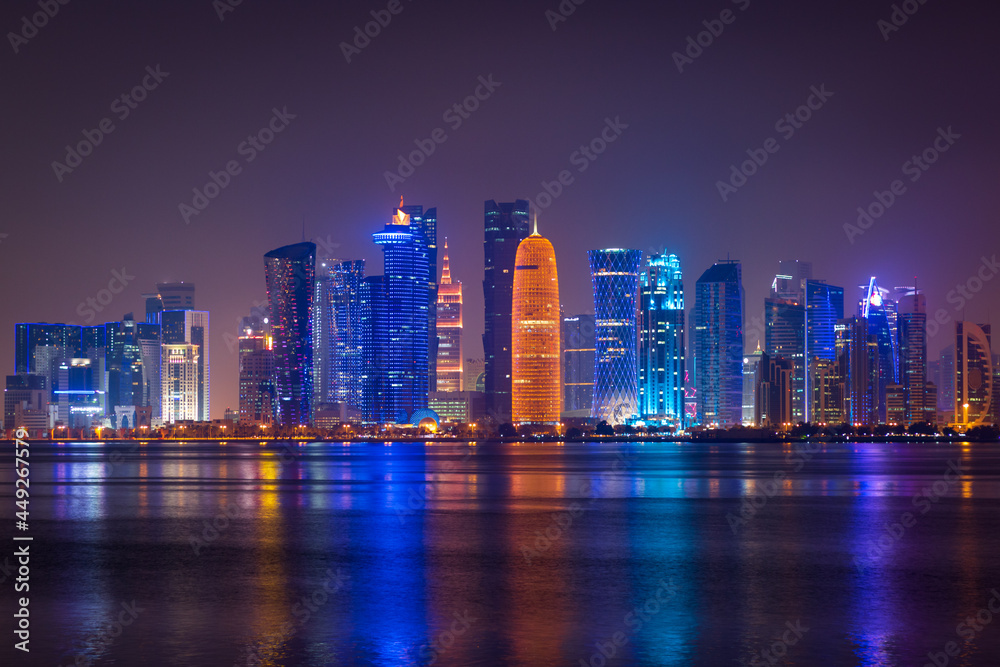 Illuminated skyline of Doha at night, Qatar, Middle East.