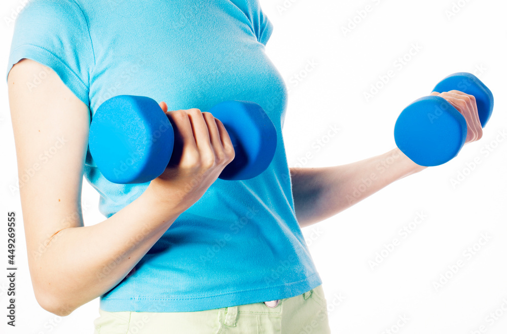 young pretty slim womans hand with dumbbell isolated, real sport girl next door, lifestyle people concept young pretty slim womans hand with dumbbell isolated, real sport girl next door, lifestyle people concept