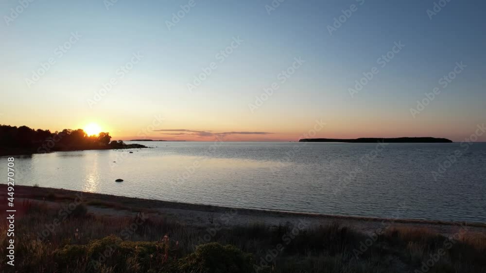 Aerial video of a beautiful sunset in Northern Estonia over the Baltic Sea. Camera slowly flying over the sea towards sun. Aerial video of a beautiful sunset in Northern Estonia over the Baltic Sea. Camera slowly flying over the sea towards sun.