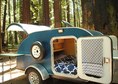 Фотография Open teardrop trailer in the forest