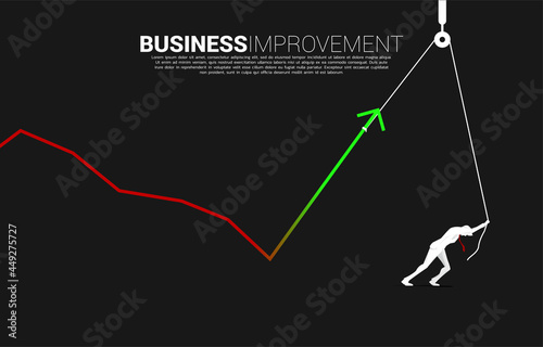 Silhouette of businessman pull up the business graph with rope and reel. concept of business improvement.