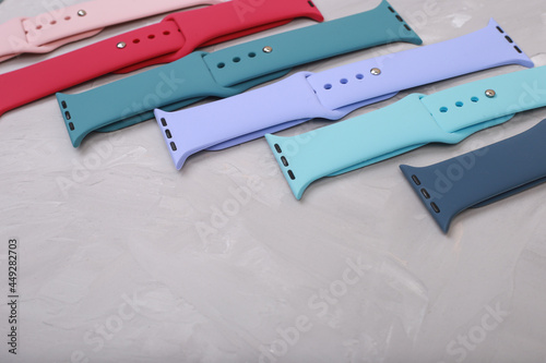 silicone straps for smart watches on a stone background. Flat lay with copyspace
