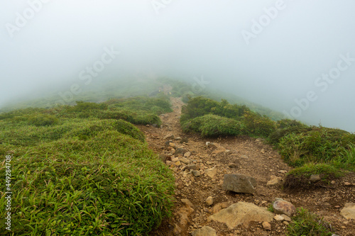 大分県玖珠郡九重町、竹田市久住町のくじゅう連山を登山している風景 A scene of climbing the Kujyu mountain range in Kusu-gun, Kokonoe-machi and Takeda-shi, Oita Prefecture.  photo