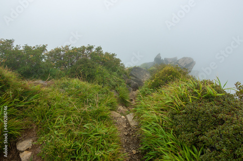 大分県玖珠郡九重町、竹田市久住町のくじゅう連山を登山している風景 A scene of climbing the Kujyu mountain range in Kusu-gun, Kokonoe-machi and Takeda-shi, Oita Prefecture.  photo