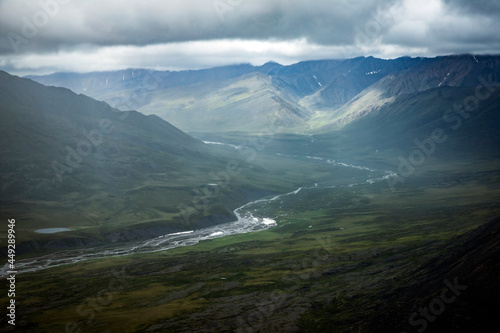 Fototapeta Naklejka Na Ścianę i Meble -  A stream flowing in the summer time in Gates of the Arctic National Park (Alaska), the least visited national park in the United States.