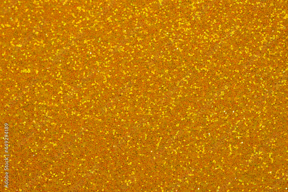 Autumn orange shiny glitter texture background with vibrant warm color