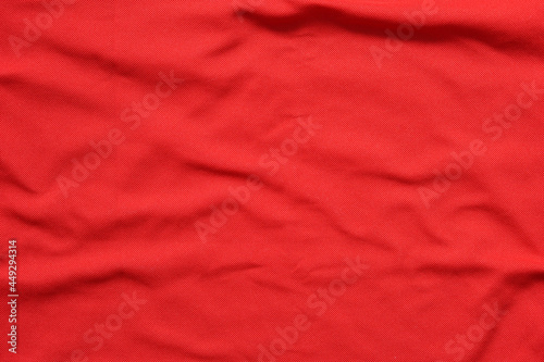 Surface of blank red clothes, texture  of red cotton waves for background.