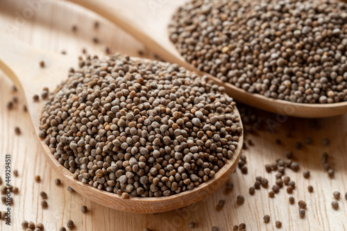 Close-up Perilla seeds in a wooden spoon are grains that can be eaten with both seeds and leaves. It can be found in the northern part of Thailand.