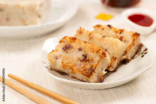 Pan fried chinese radish cake, turnip cake or daikon cake ready to be served photo