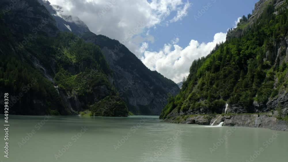 Dam and reservoir with low water level in the Swiss Alps Dam and reservoir with low water level in the Swiss Alps