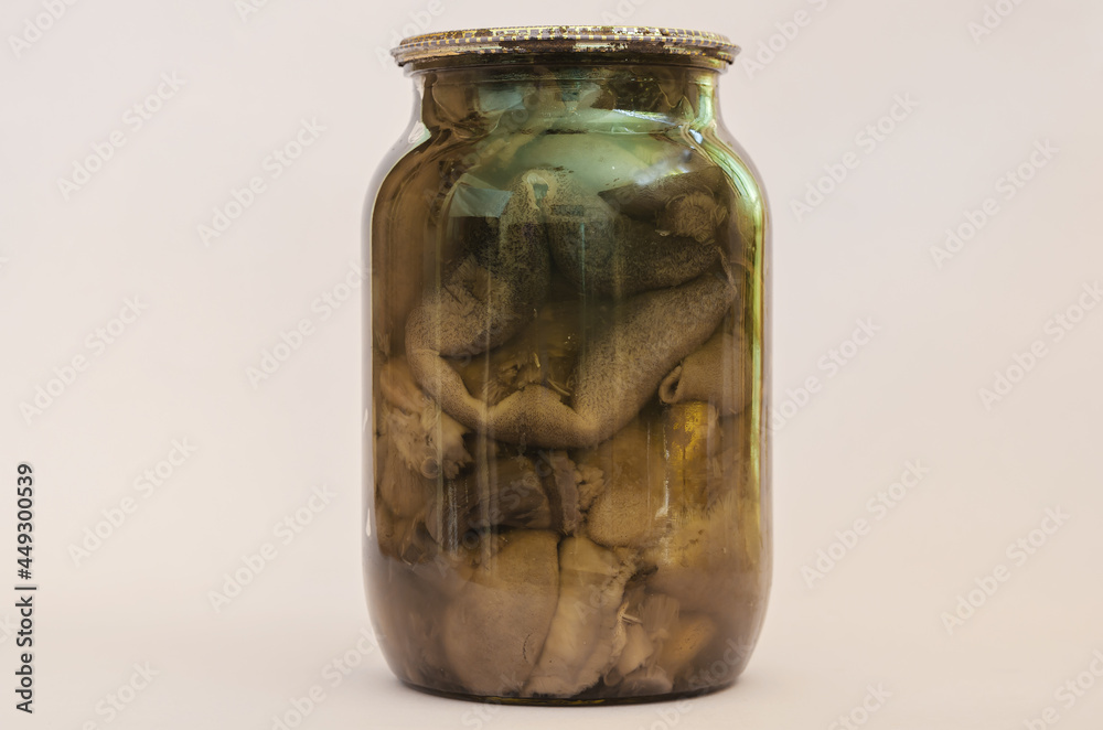 Botulism, food poisoning from canned foods concept. Glass jar wi Botulism, food poisoning from canned foods concept. Glass jar wi