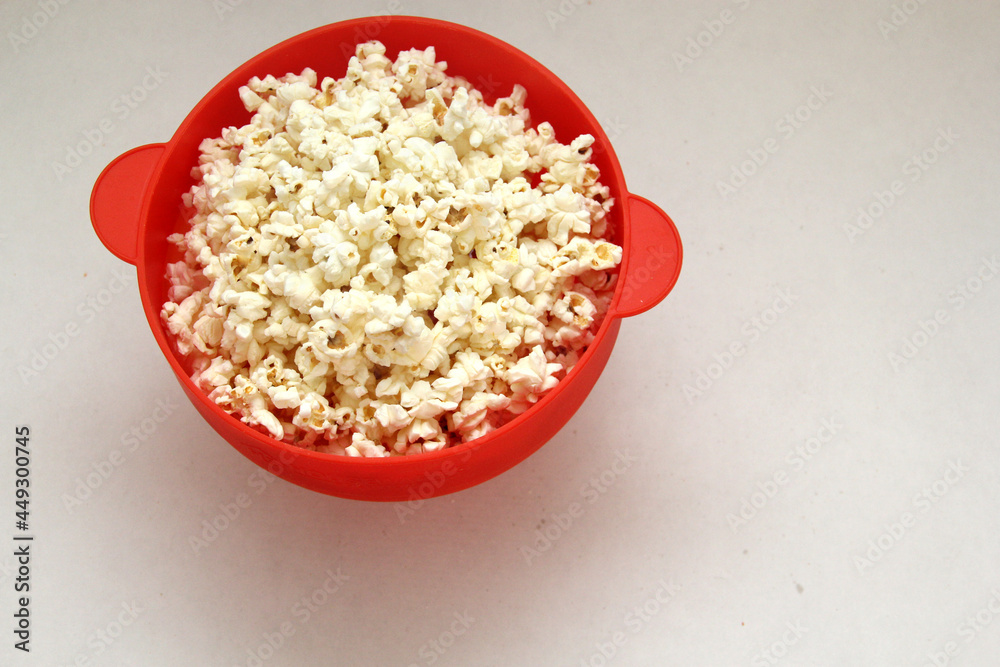Natural popcorn with natural corn in a container or paper bag ready for a movie
Natural popcorn with natural corn in a container or paper bag ready for a movie