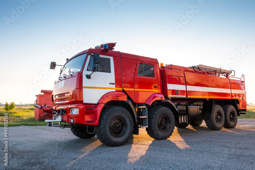 Slika na platnu Red airfield firetruck at the morning airport