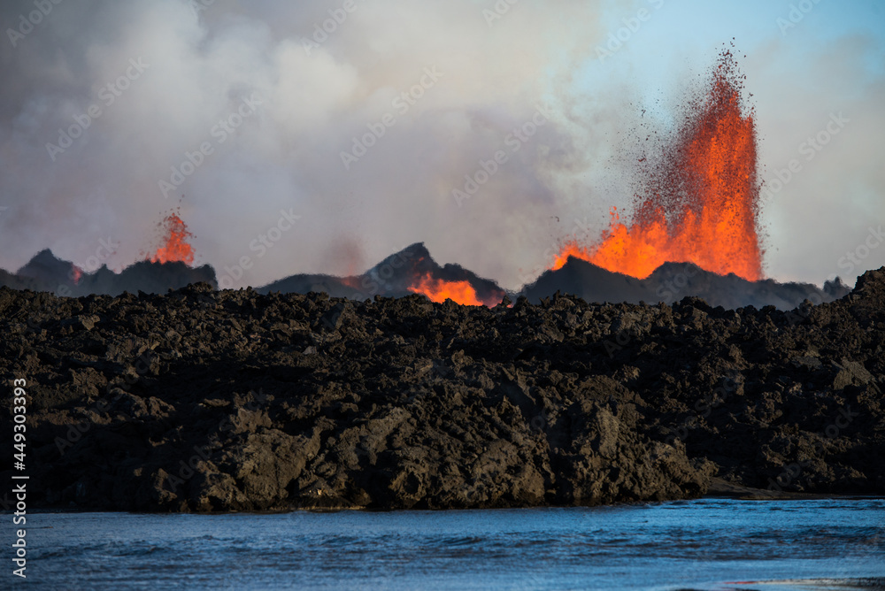 Fototapeta premium The 2014 Bárðarbunga eruption at the Holuhraun fissures across a river, Central Highlands, Iceland