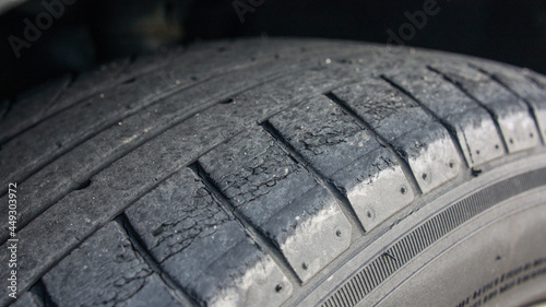 Car tire in poor condition. Cracks in tire. Tire Cracking. Cracked Tire. photo