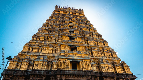 Entrance tower ( Gopuram) of Varadharaja Perumal Temple and Lord Atthi Varadar Perumal god statue inside the pond, Kanchipuram, Tamil Nadu, South India - Religion and Worship scenario image photo