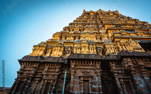 Entrance tower ( Gopuram) of Varadharaja Perumal Temple and Lord Atthi Varadar Perumal god statue inside the pond, Kanchipuram, Tamil Nadu, South India - Religion and Worship scenario image