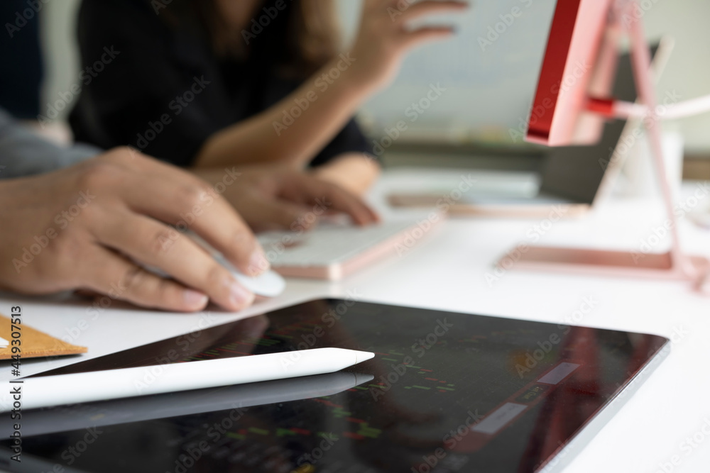 Digital tablet with stock chart data on white office desk. Digital tablet with stock chart data on white office desk.