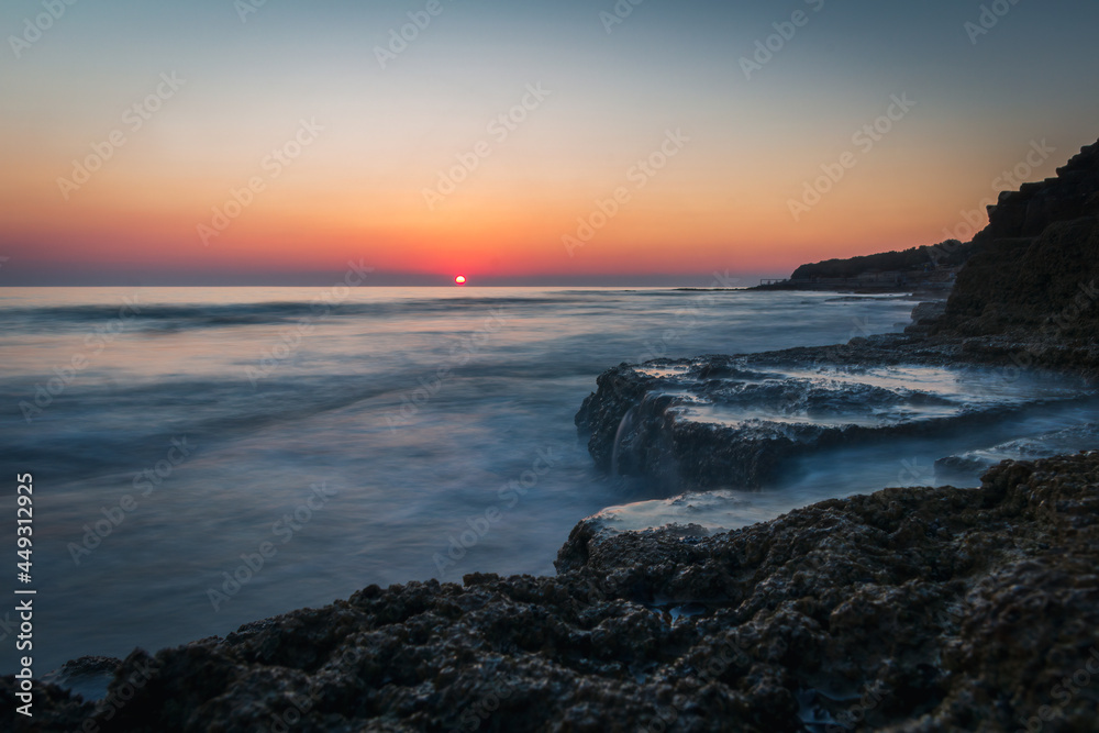 Sea cliff, rock at clear sunset sky. Long exposure, Istria, Croatia