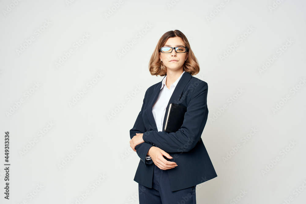 woman in a suit with glasses work manager woman in a suit with glasses work manager