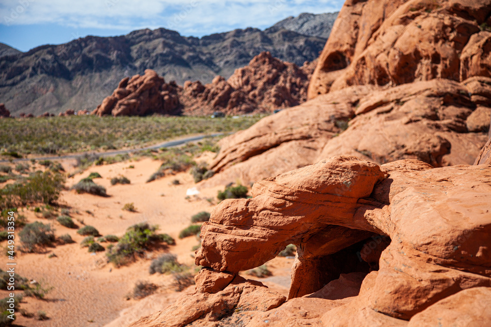 Red sandstone eroded with a road winding through the national park in America
