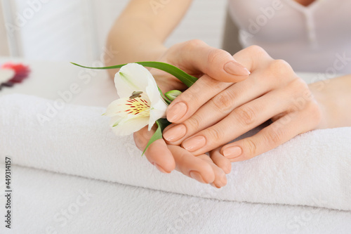 Woman with beautiful manicure in salon