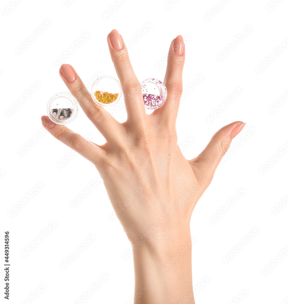 Female hand with beautiful manicure and glitters on white background, closeup Female hand with beautiful manicure and glitters on white background, closeup