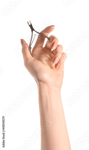 Female hand with beautiful manicure and nail cutter on white background  closeup