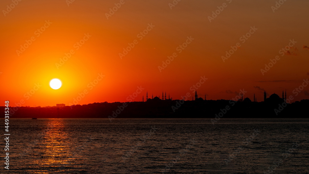 Sunset over Istanbul. Siluets mosques of a city