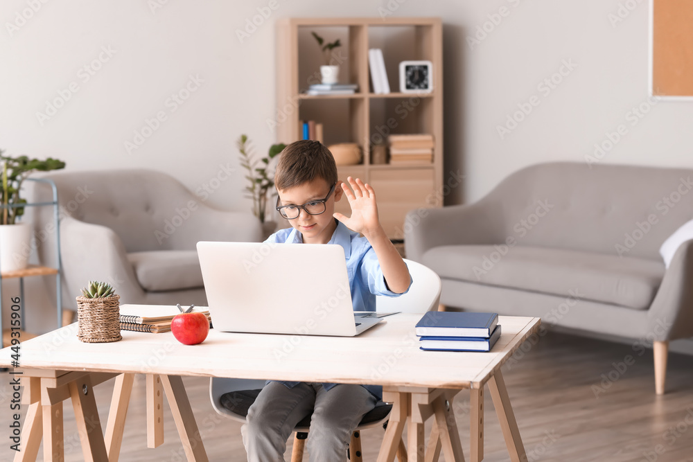 Little schoolboy studying online at home Little schoolboy studying online at home