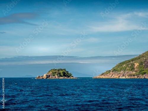 Rocky Island of the Coast on a Blue Sky Day