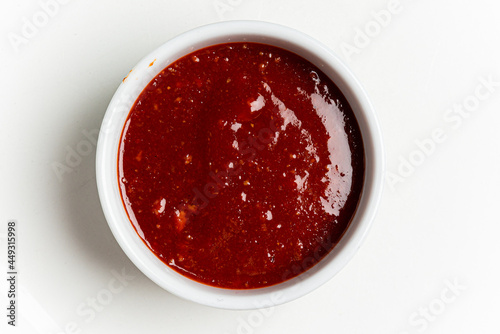 bbq sauce in the white bowl