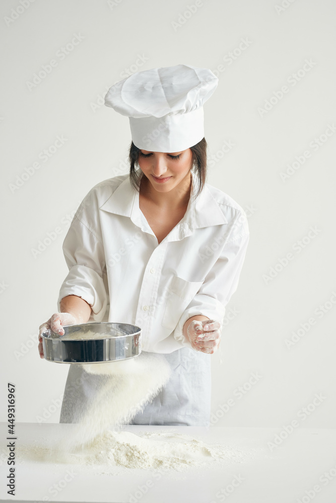 woman chef kneading dough working with flour Professional woman chef kneading dough working with flour Professional