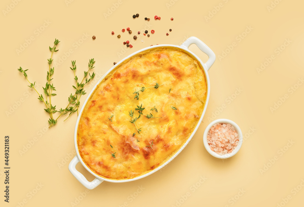 Casserole with mashed potatoes and spices on color background Casserole with mashed potatoes and spices on color background