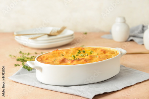 Casserole with mashed potatoes on table