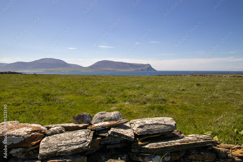 The rural landscape of the Orkney Islands in Scotland, UK The rural landscape of the Orkney Islands in Scotland, UK