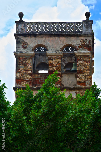 Closeup shot of an old semi-destroyed ancient tower in Bayamo city, Cuba photo